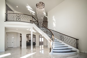 Custom Foyer with Staircase and rails