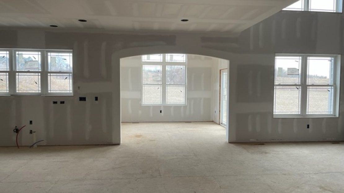 under construction, drywall finish, windows, entrance to sunroom